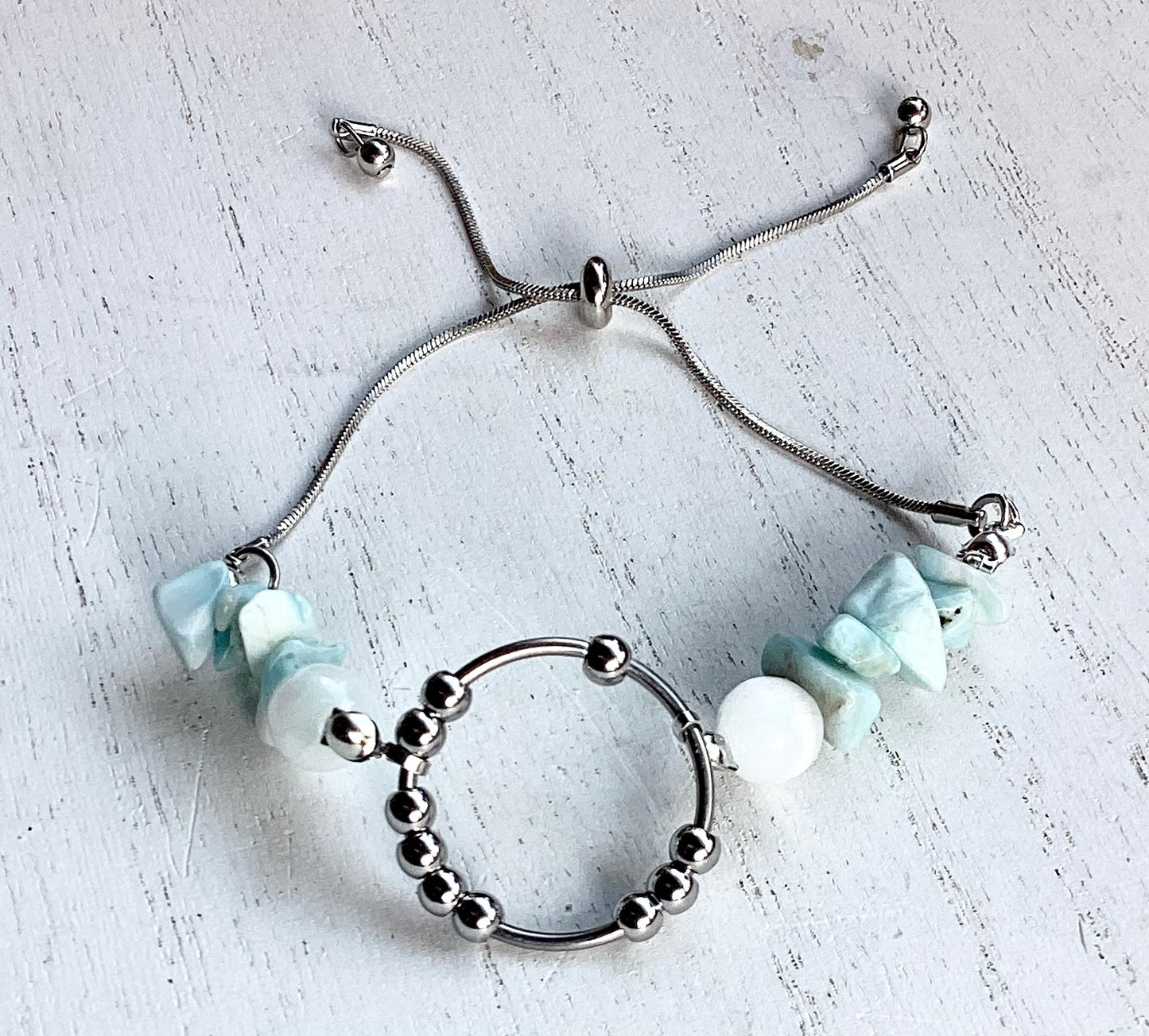 ## Serenity & Clarity: Larimar Chip & Selenite Fidget Bracelet